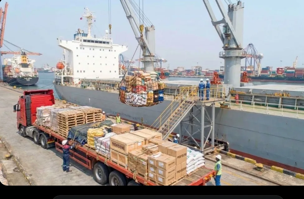 Provisions and stores being lifted aboard a vessel by crane